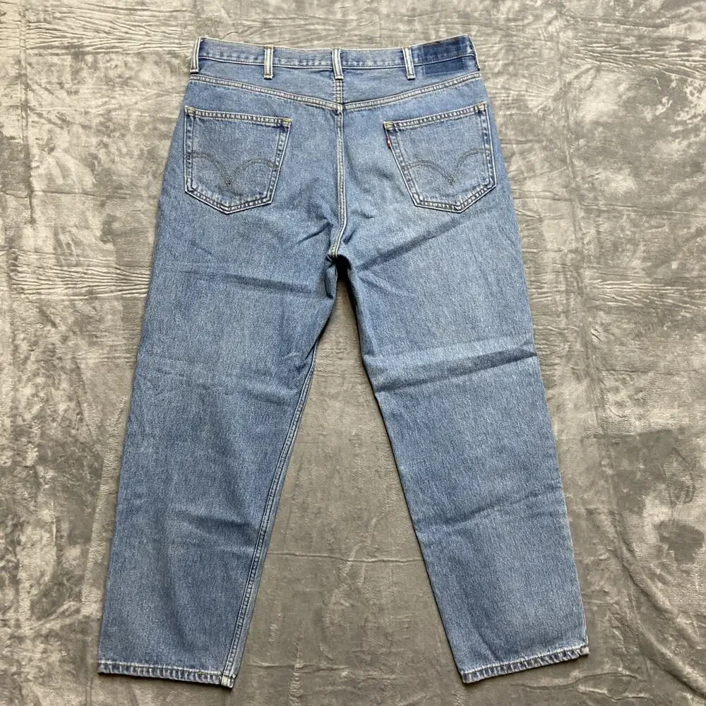 Vintage Levi's 550 Relaxed Fit Jeans Men's Size 38x30 Light‎ Blue Denim